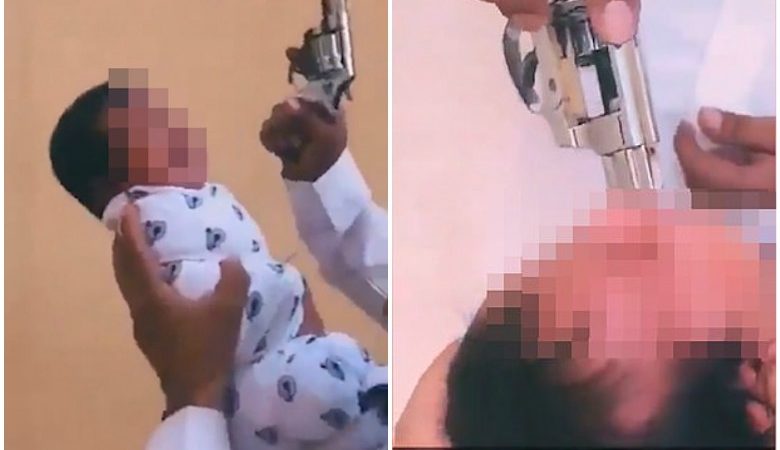 Άνδρας πυροβολεί στον αέρα και βάζει το όπλο στο στόμα ενός νεογέννητου